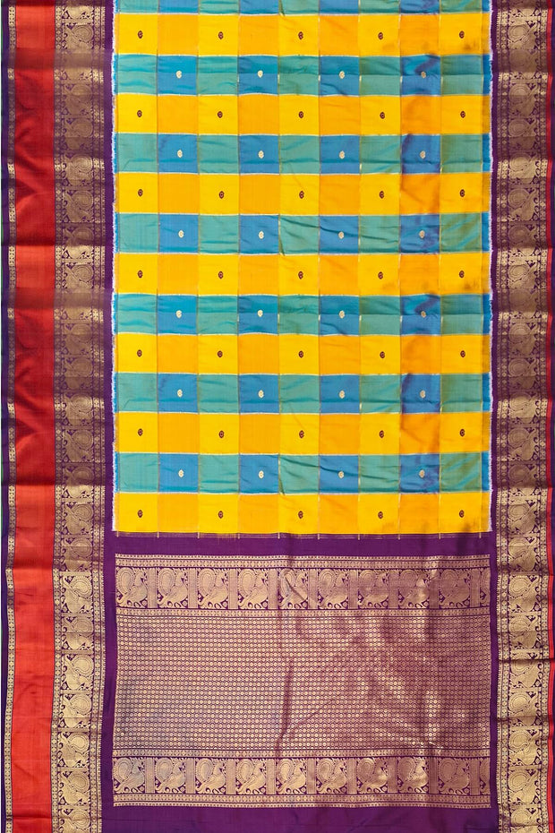 Handwoven ikat pure silk saree in multicolour with zari checks and small floral woven motifs .