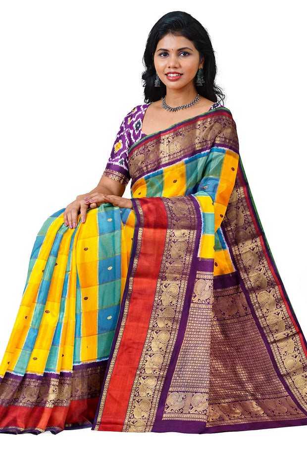 Handwoven ikat pure silk saree in multicolour with zari checks and small floral woven motifs .