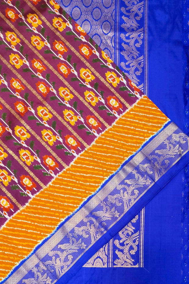 Handwoen ikat pure silk saree in purple with floral vines.