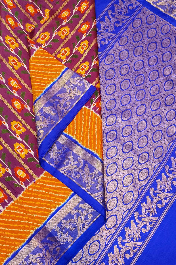Handwoen ikat pure silk saree in purple with floral vines.