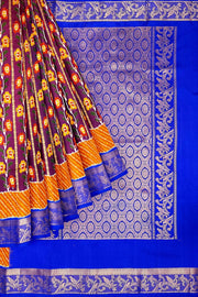 Handwoen ikat pure silk saree in purple with floral vines.