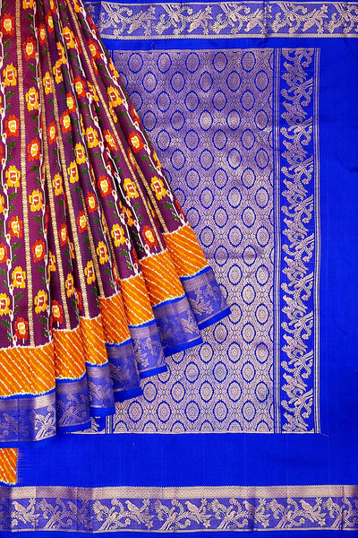 Handwoen ikat pure silk saree in purple with floral vines.