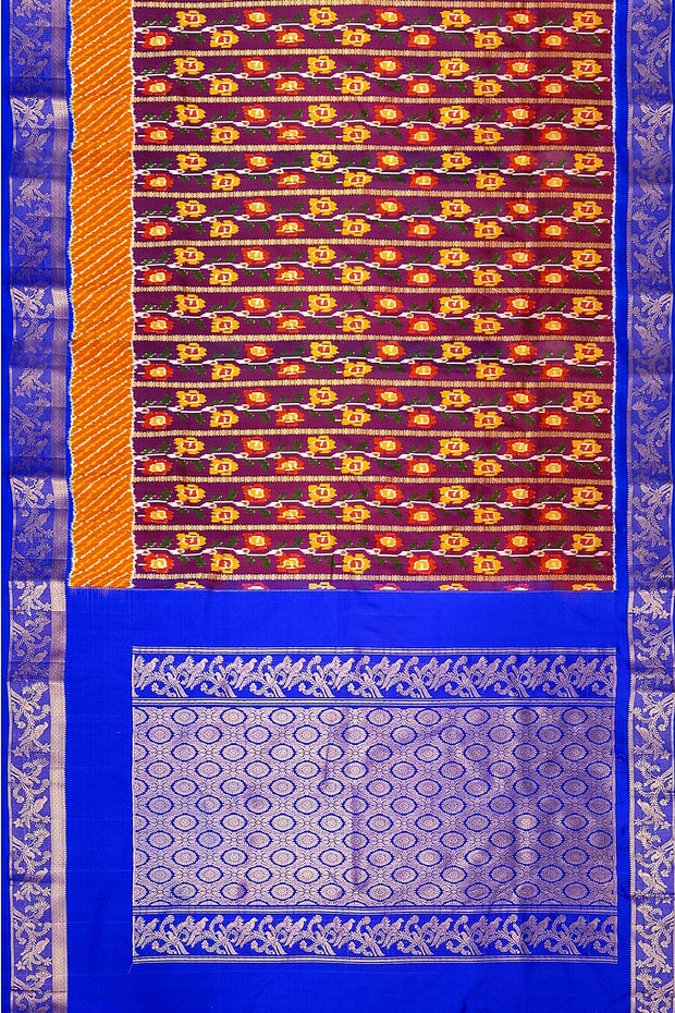 Handwoen ikat pure silk saree in purple with floral vines.