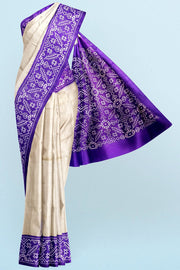 Handwoven Ikat pure silk saree in off white & purple
