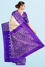 Handwoven Ikat pure silk saree in off white & purple
