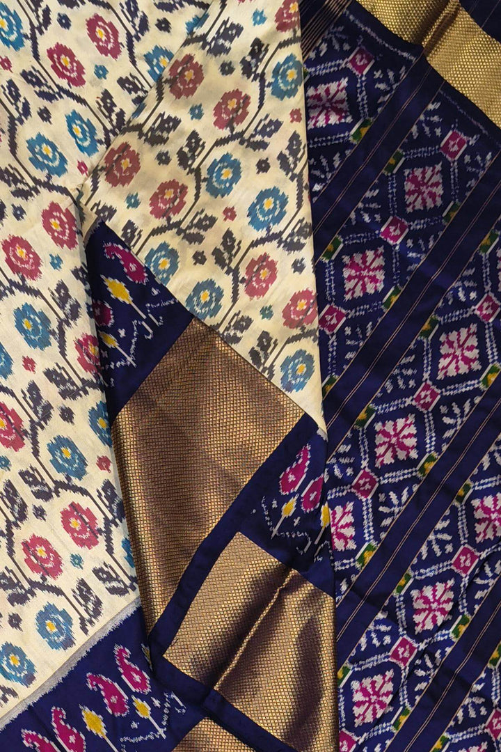 Ikkat pure silk saree in off white with floral motifs