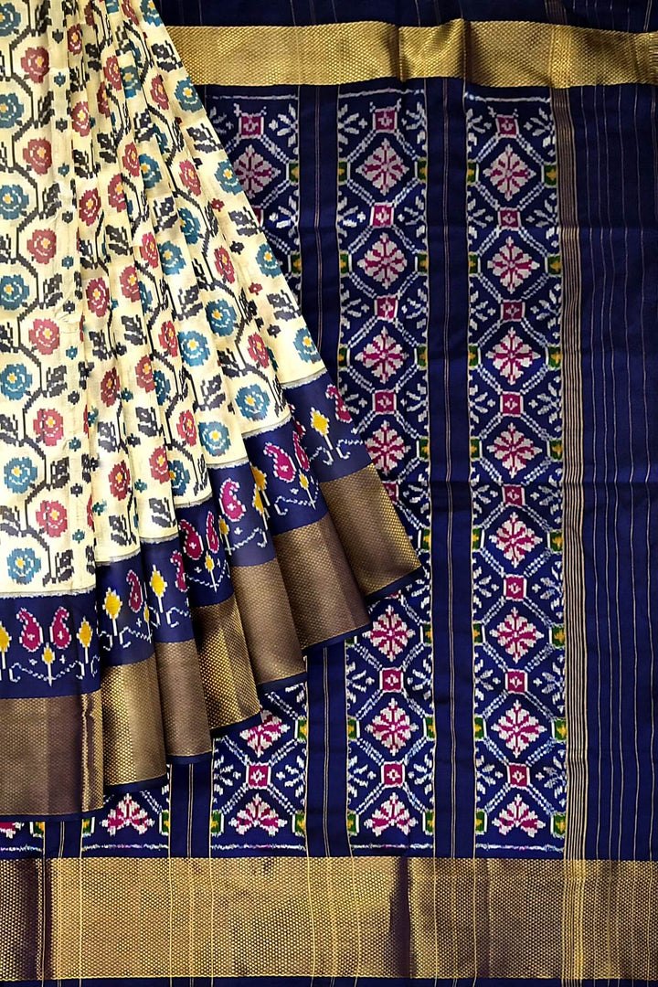 Ikkat pure silk saree in off white with floral motifs