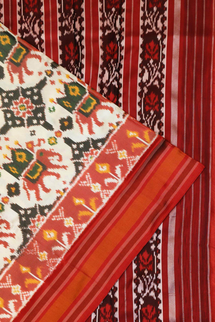 A twill weave ikkat pure silk saree in  off white