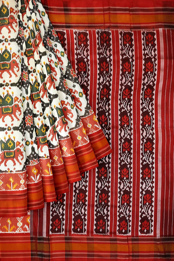 A twill weave ikkat pure silk saree in  off white