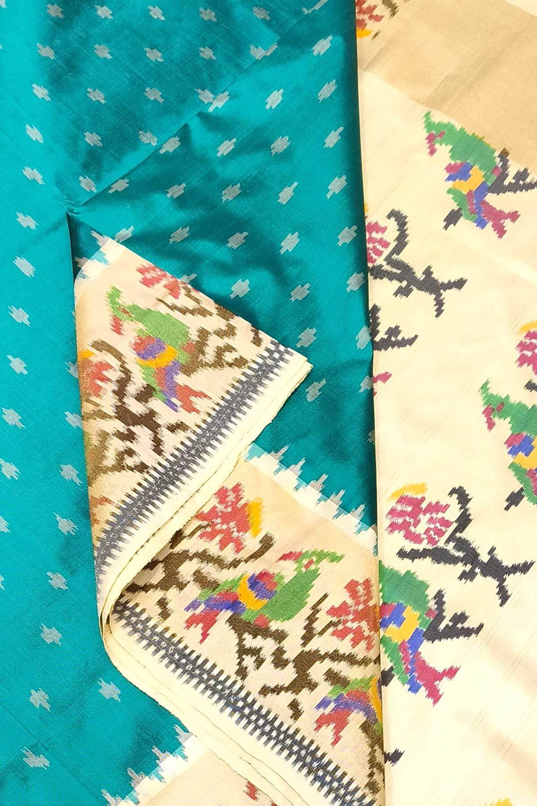 Handwoven Ikat pure silk saree in green with small motifs