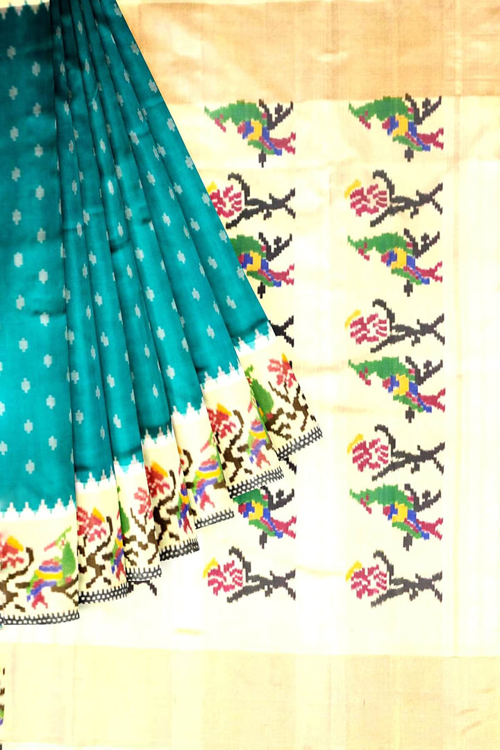 Handwoven Ikat pure silk saree in green with small motifs