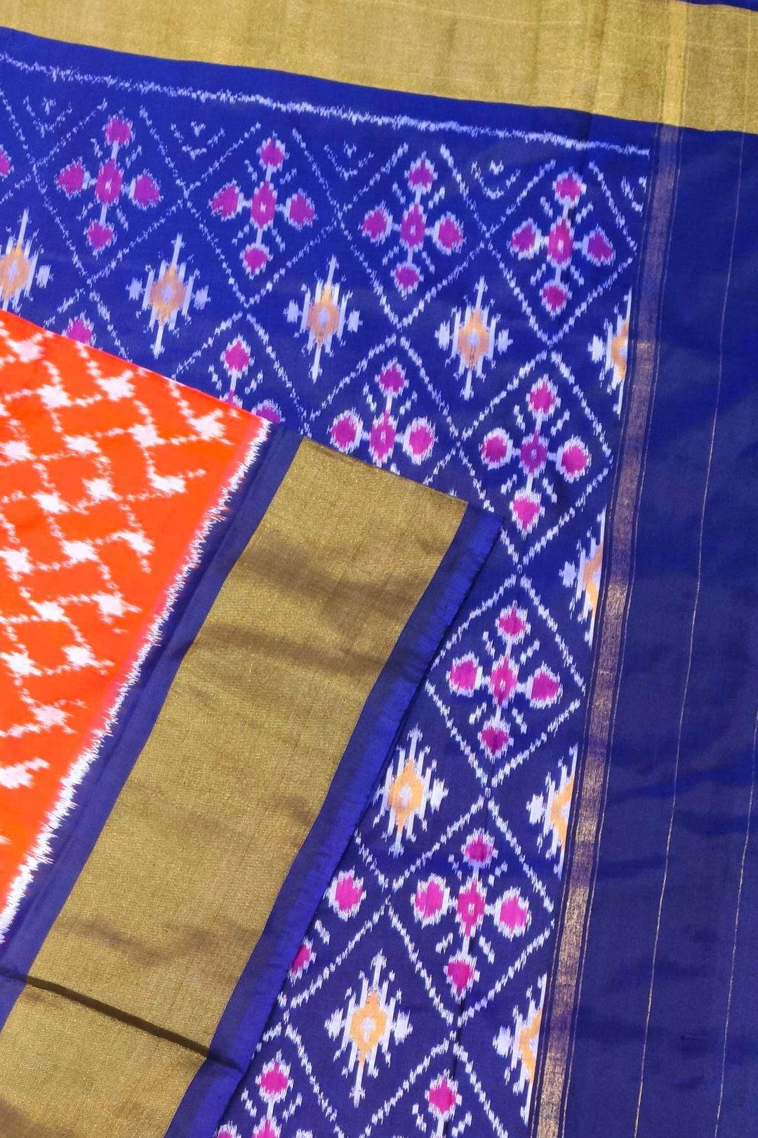 Handwoven Ikat pure silk saree in orange in wavy pattern
