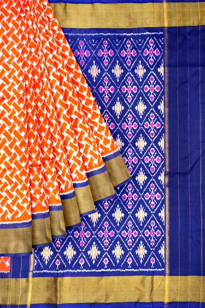 Handwoven Ikat pure silk saree in orange in wavy pattern
