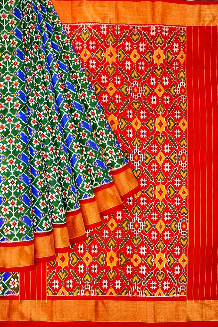 Handwoven Ikat pure silk saree in green & blue  in floral pattern