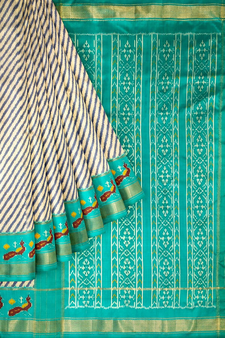 Handwoven ikat pure silk saree in grey in diagonal lines