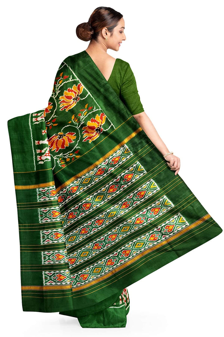 A twill weave ikkat pure silk saree in bottle green