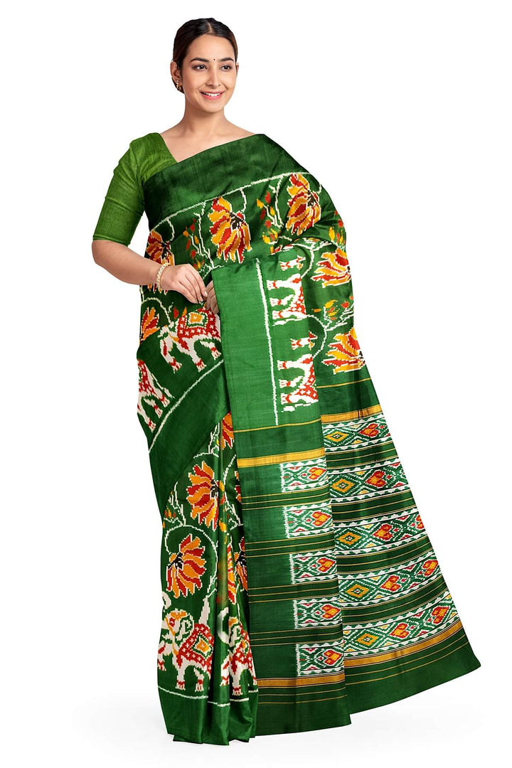 A twill weave ikkat pure silk saree in bottle green