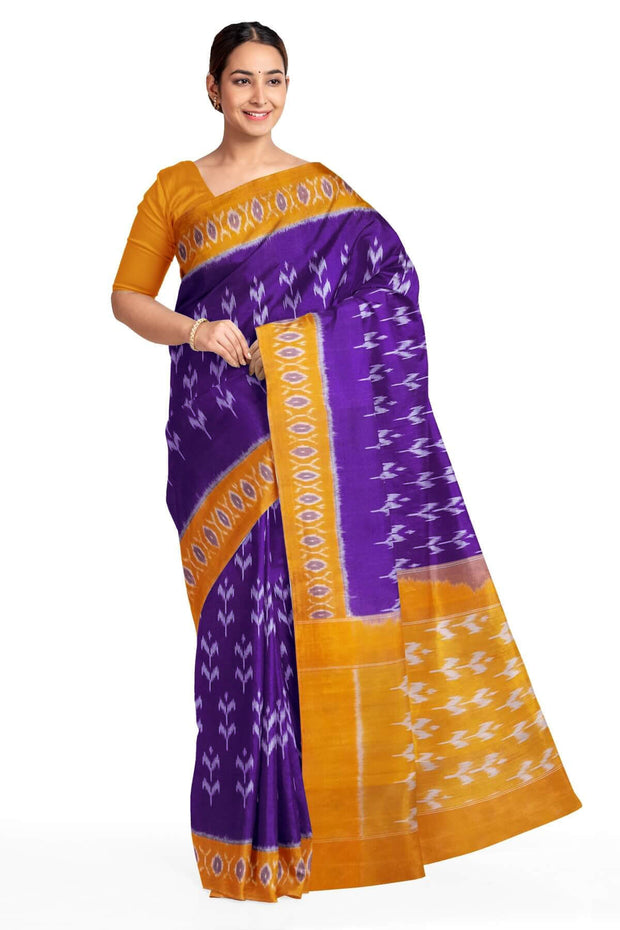 Handwoven ikat pure cotton saree in violet  with floral motifs .