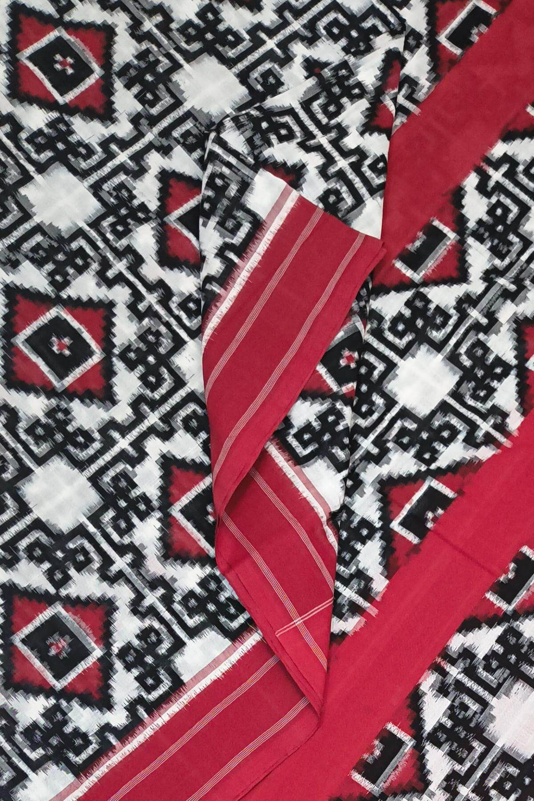Handwoven double ikkat telia  pure cotton saree in  off white