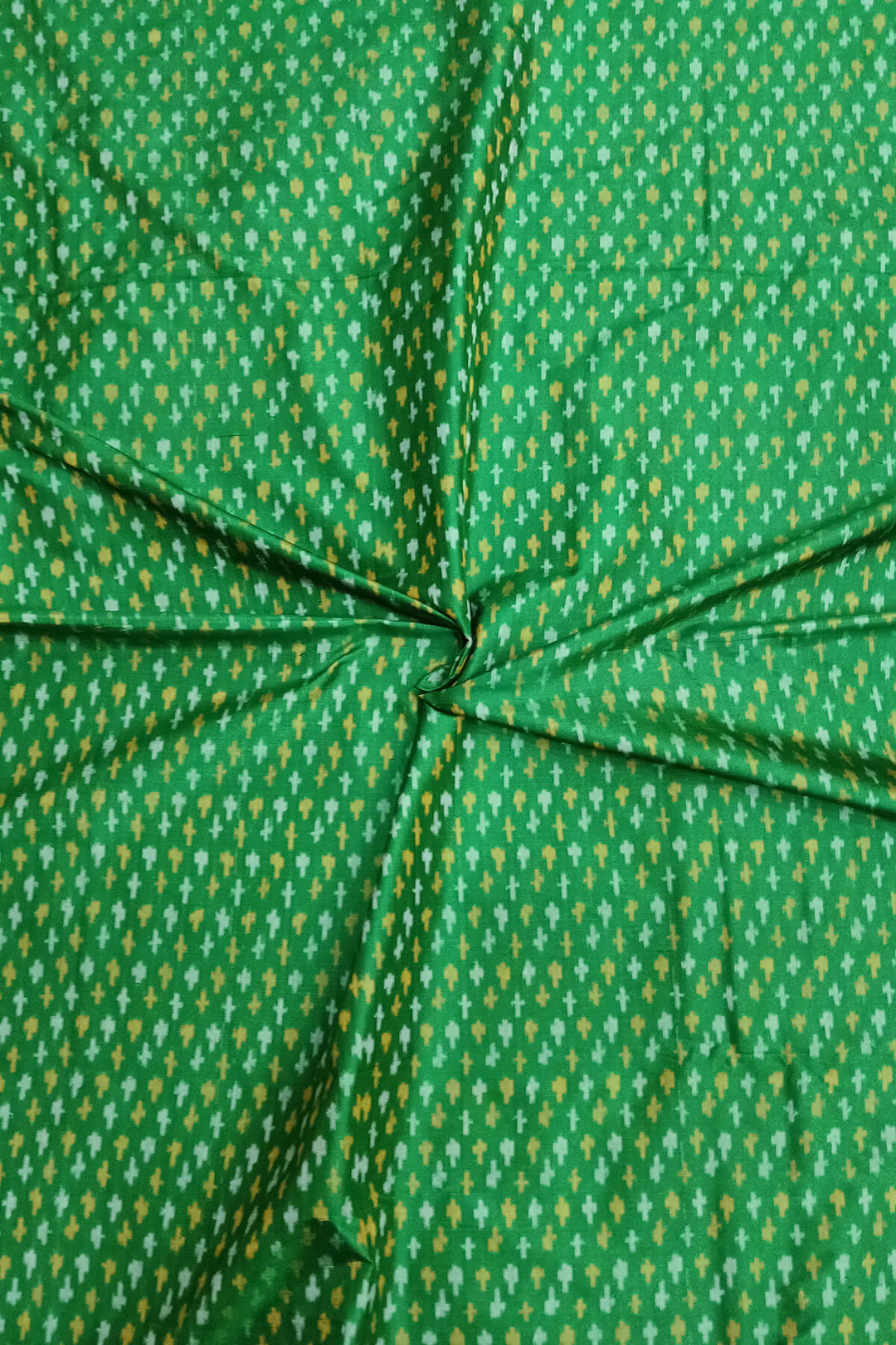 Handwoven Ikat pure silk fabric in green with small motifs