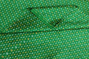Handwoven Ikat pure silk fabric in green with small motifs