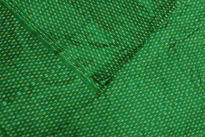 Handwoven Ikat pure silk fabric in green with small motifs