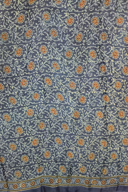Dola silk saree in blue  with floral motifs in  hand block Ajrakh print .
