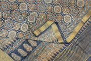 Dola silk saree in blue  with floral motifs in  hand block Ajrakh print .