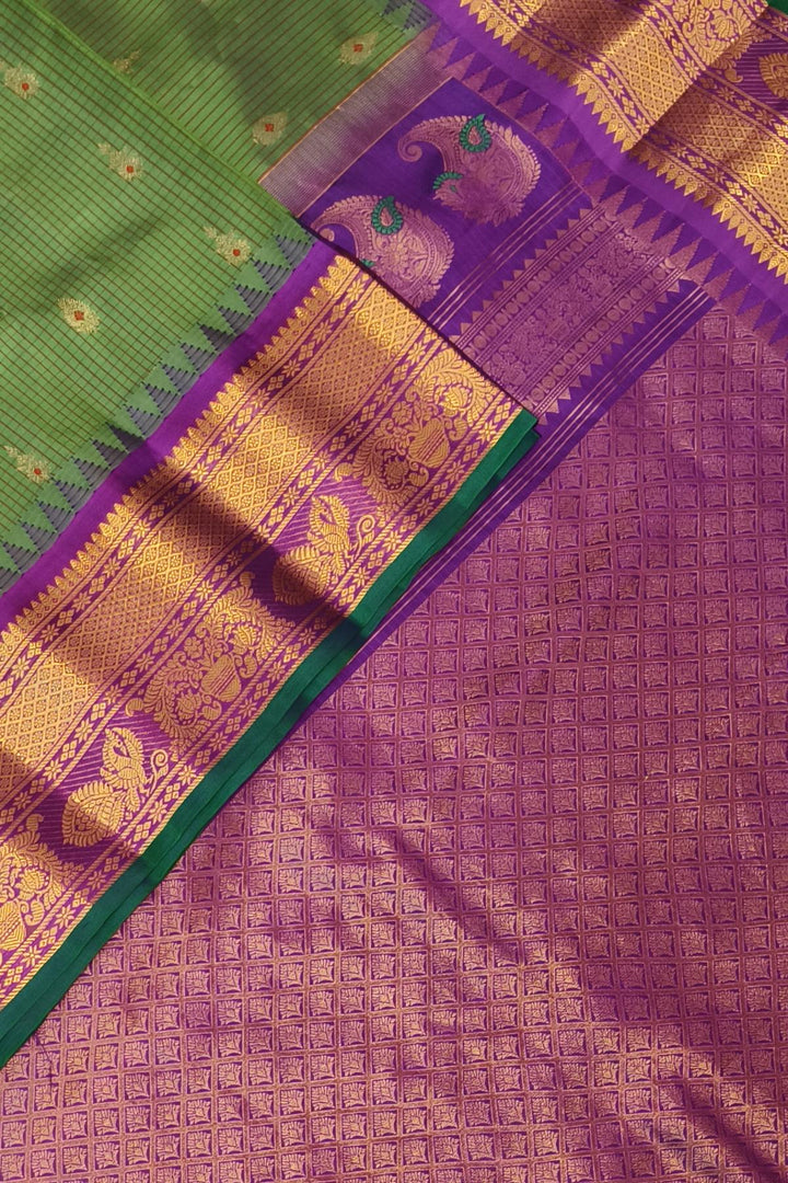 Gadwal pure silk saree in olive green & purple with checks & buttis.