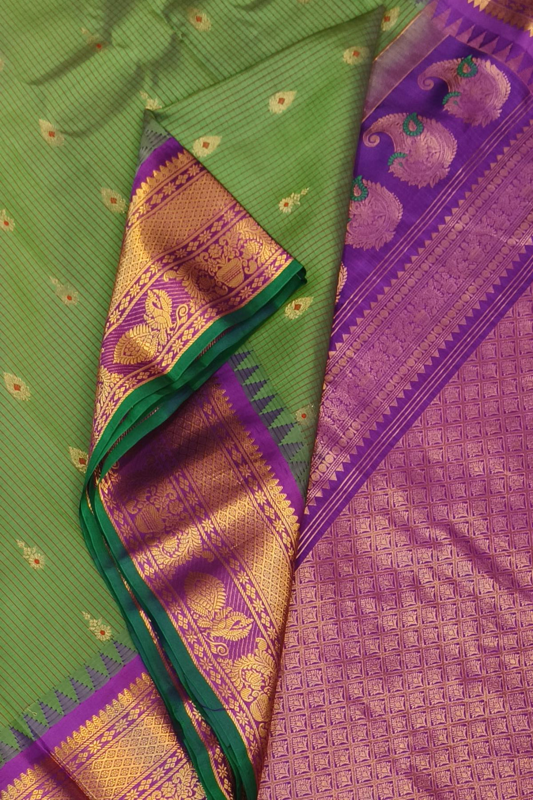 Gadwal pure silk saree in olive green & purple with checks & buttis.