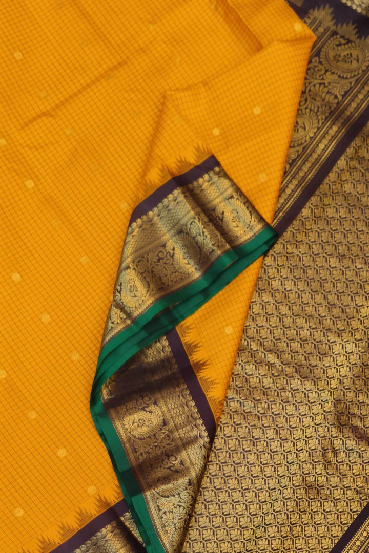 Gadwal pure silk saree in mustard & brown with checks & buttis.
