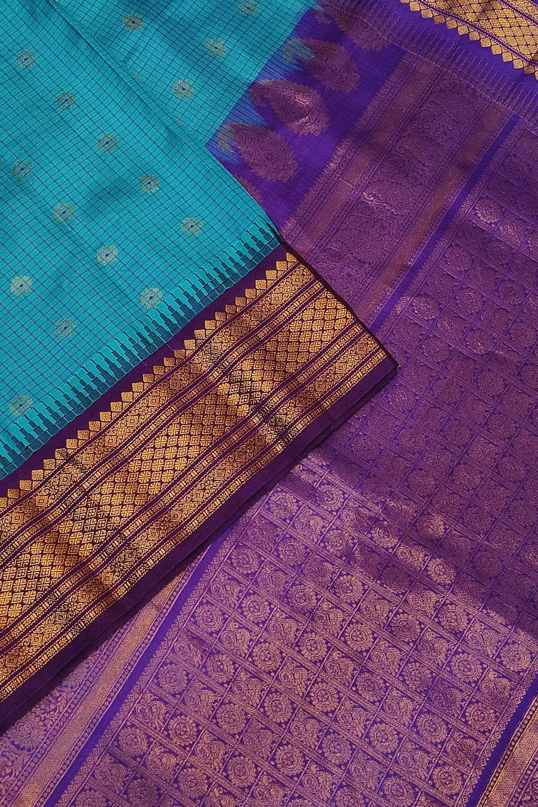 Gadwal pure silk saree in ananda blue & purple with checks & buttis.