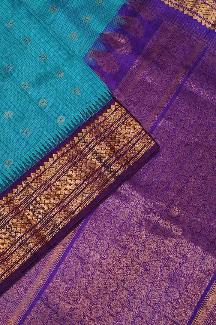 Gadwal pure silk saree in ananda blue & purple with checks & buttis.