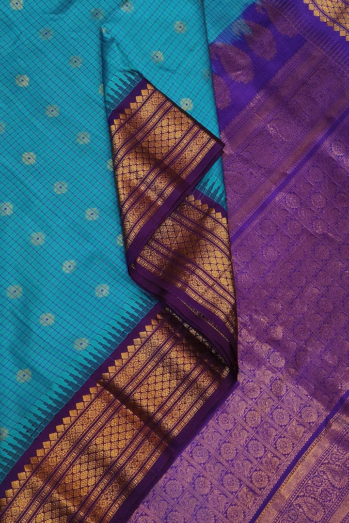Gadwal pure silk saree in ananda blue & purple with checks & buttis.
