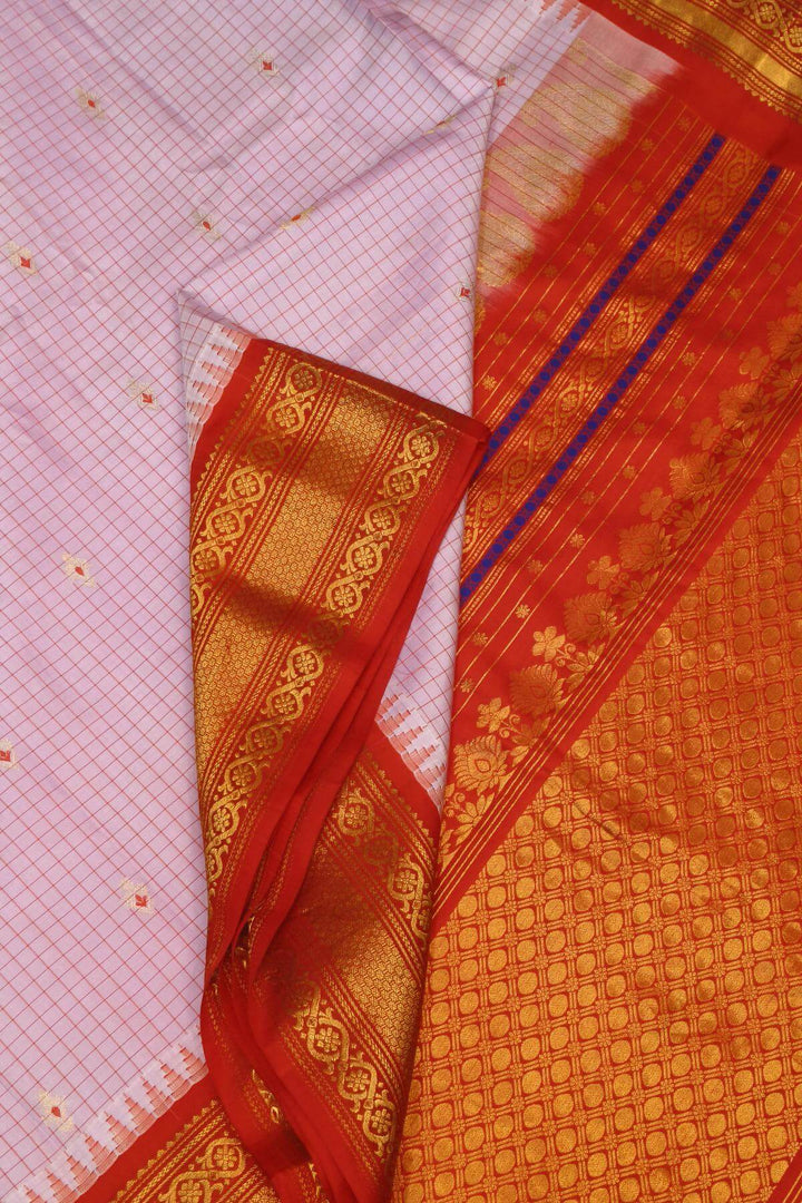 Gadwal pure silk saree in baby pink & red with checks & buttis.