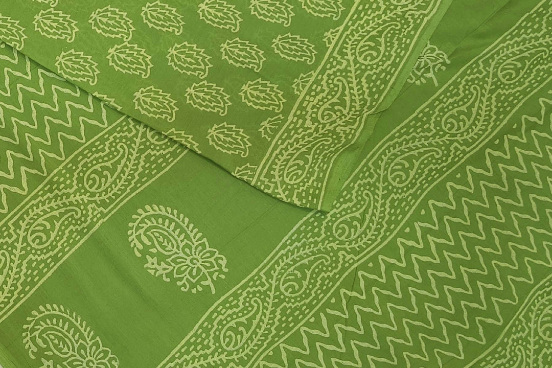 Jaipur mul cotton saree in green  with paisley motifs.