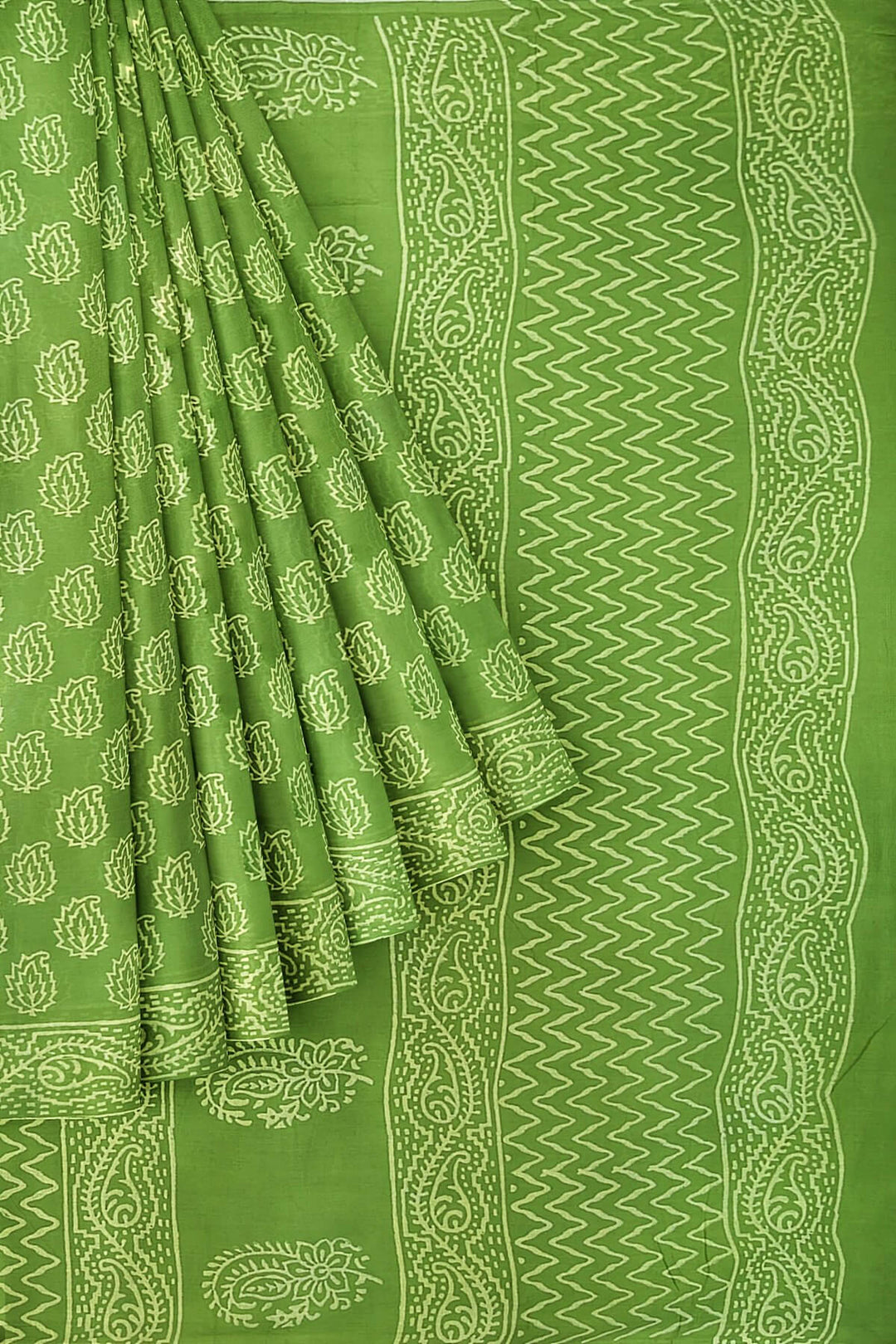 Jaipur mul cotton saree in green  with paisley motifs.