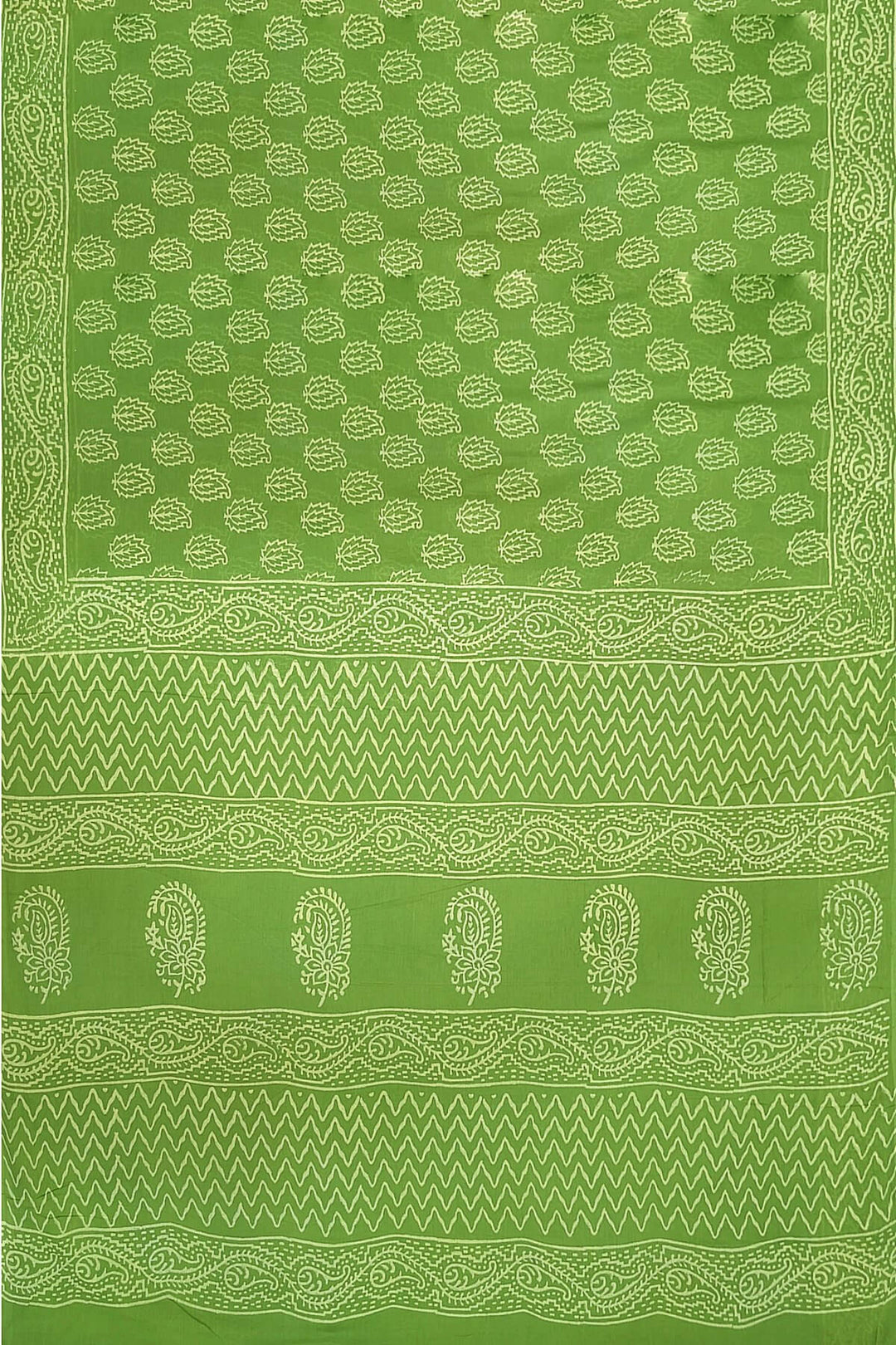 Jaipur mul cotton saree in green  with paisley motifs.