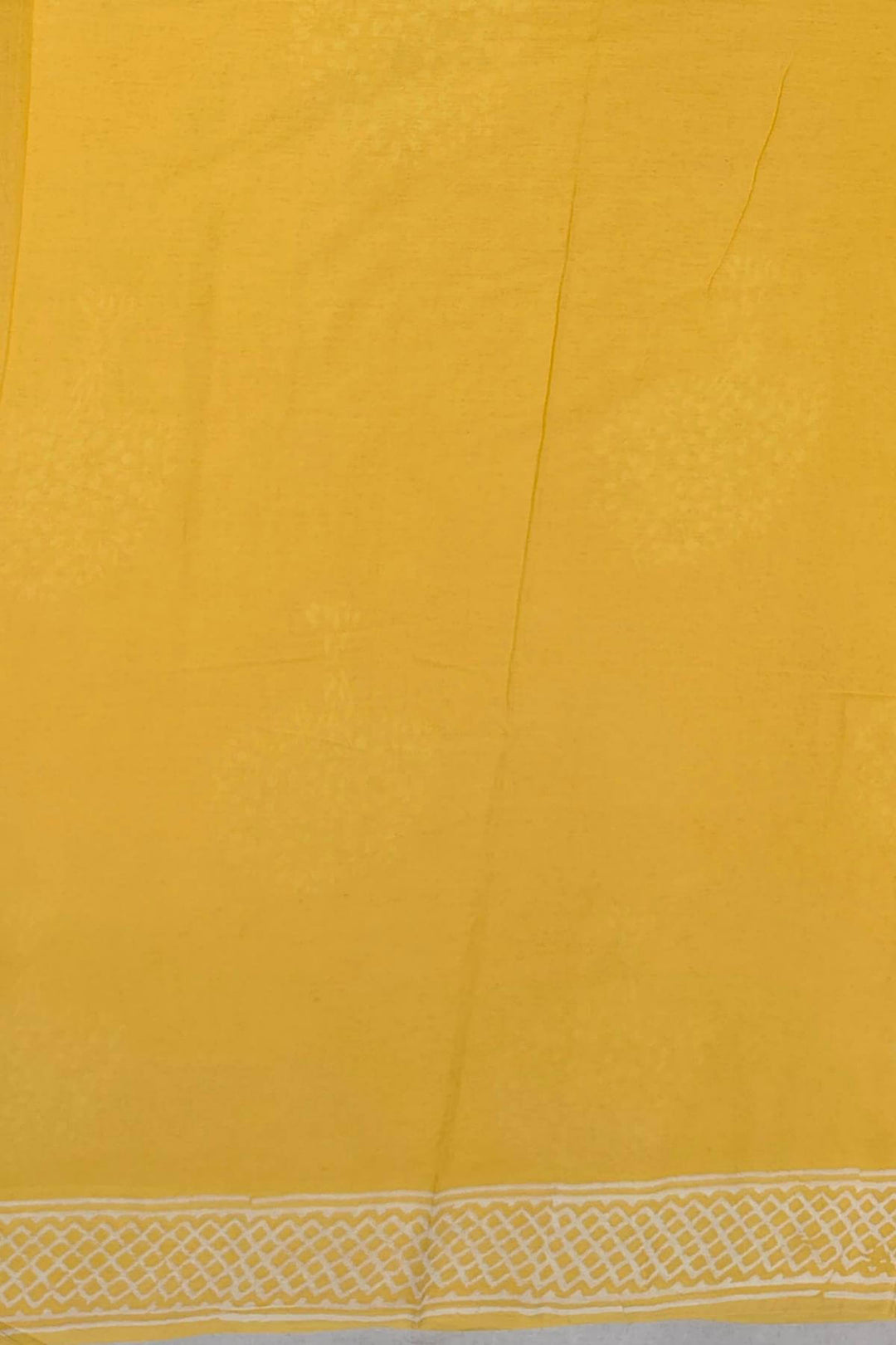 Jaipur mul cotton saree in light yellow  with plant motifs.