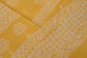 Jaipur mul cotton saree in light yellow  with plant motifs.