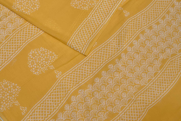 Jaipur mul cotton saree in light yellow  with plant motifs.