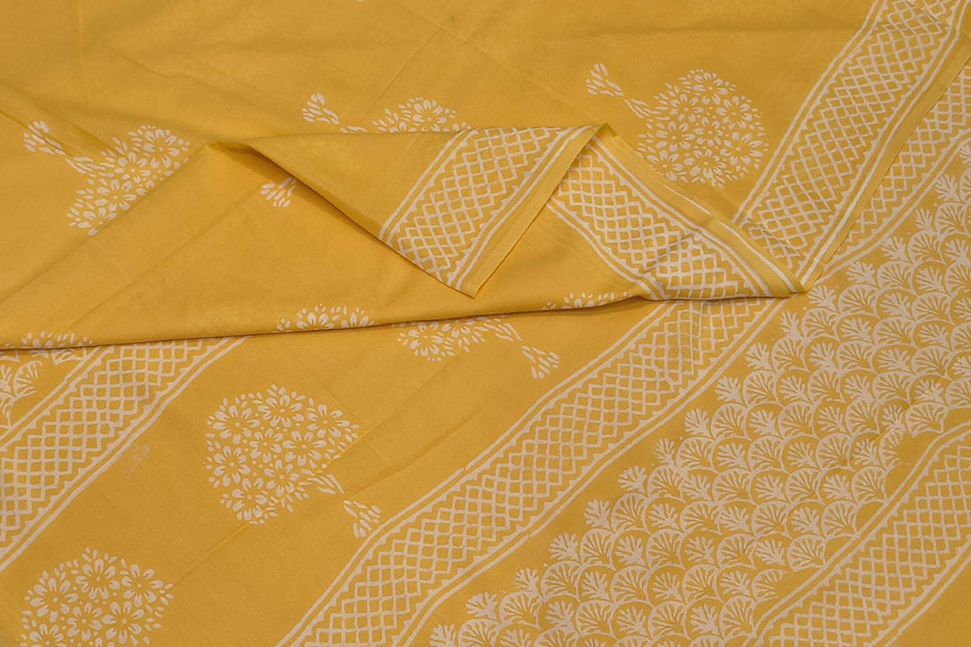 Jaipur mul cotton saree in light yellow  with plant motifs.