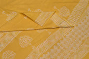 Jaipur mul cotton saree in light yellow  with plant motifs.