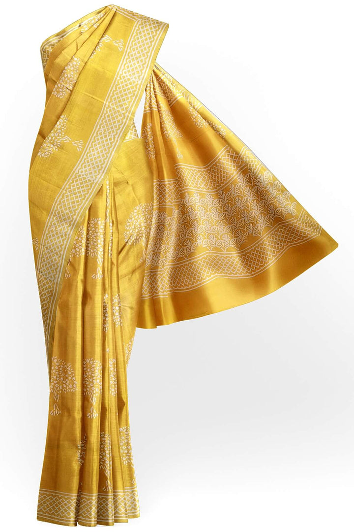 Jaipur mul cotton saree in light yellow  with plant motifs.