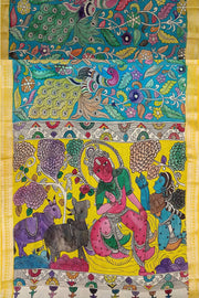 Hand painted Kalamkari on Bangalore silk saree in blue with coloured peacocks.