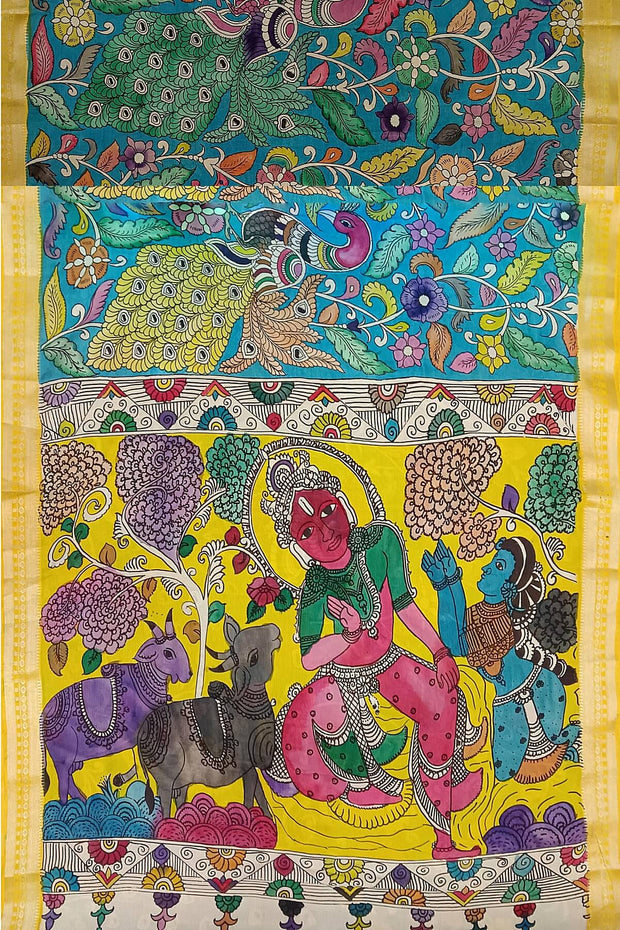 Hand painted Kalamkari on Bangalore silk saree in blue with coloured peacocks.