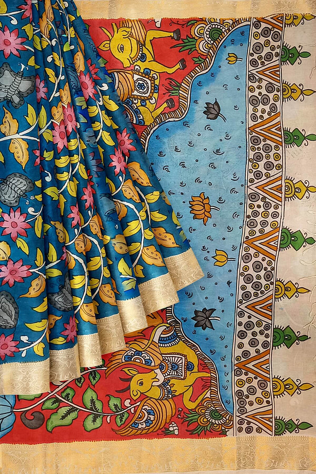 Hand painted Kalamari on Bangalore silk saree in  peacock blue with floral vines & peacocks.
