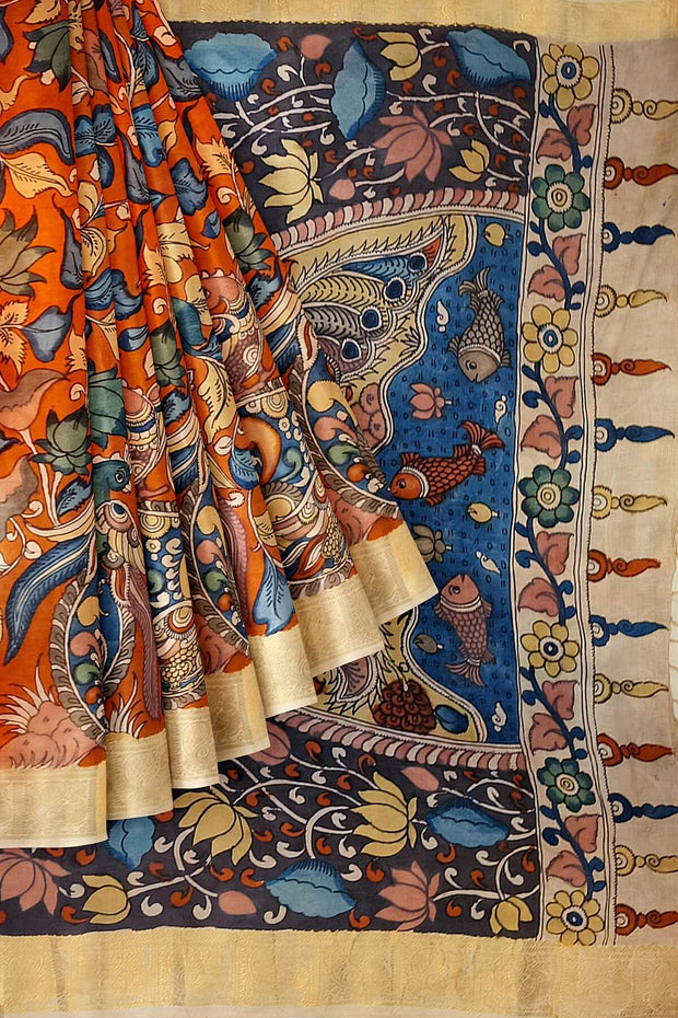 Hand painted Kalamari on Bangalore silk saree in brick red with floral vines .