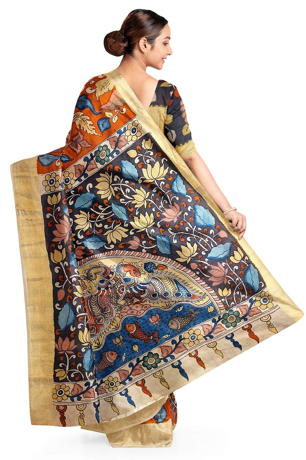 Hand painted Kalamari on Bangalore silk saree in brick red with floral vines .