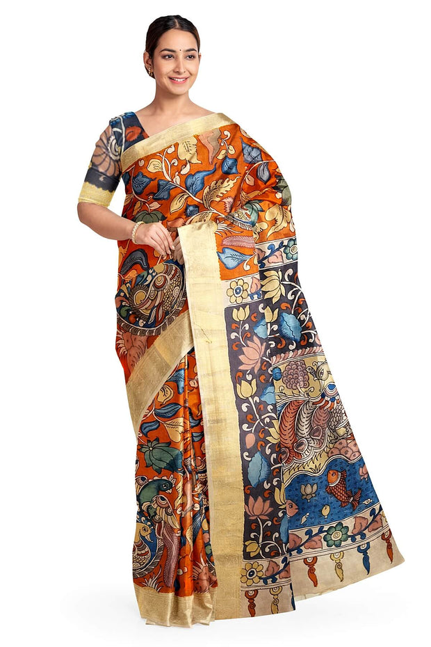 Hand painted Kalamari on Bangalore silk saree in brick red with floral vines .